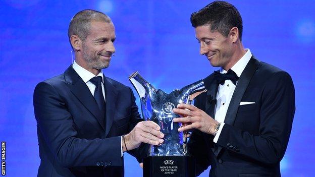 Robert Lewandowski receiving the UEFA Men